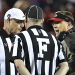 
              Louisville head coach Scott Satterfield, right, argues with game officials during the second half of an NCAA college football game against James Madison in Louisville, Ky., Saturday, Nov. 5, 2022. Louisville won 34-10. (AP Photo/Timothy D. Easley)
            