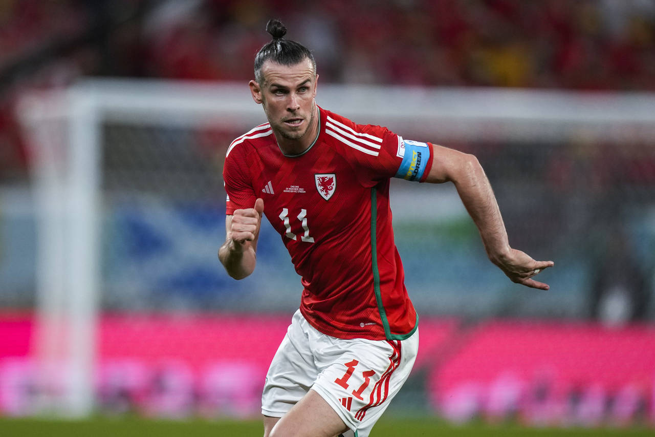 Wales' Gareth Bale runs during the World Cup group B soccer match between England and Wales, at the...