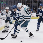 
              San Jose Sharks' Steven Lorentz (16) vies for the puck against Toronto Maple Leafs' Pontus Holmberg (29) during the first period of an NHL hockey game Wednesday, Nov. 30, 2022, in Toronto. (Chris Young/The Canadian Press via AP)
            