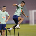 
              Brazil's Gabriel Jesus exercises during a training session at the Grand Hamad stadium in Doha, Qatar, Tuesday, Nov. 29, 2022. Brazil will face Cameroon in a group G World Cup soccer match on Dec. 2. (AP Photo/Andre Penner)
            