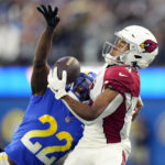 
              Arizona Cardinals wide receiver Rondale Moore (4) makes a one-handed catch in front of Los Angeles Rams cornerback David Long Jr. (22) during the second half of an NFL football game Sunday, Nov. 13, 2022, in Inglewood, Calif. (AP Photo/Jae C. Hong)
            