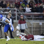 
              BYU wide receiver Puka Nacua, left, avoids a tackle attempt by Stanford cornerback Nicolas Toomer during the first half of an NCAA college football game in Stanford, Calif., Saturday, Nov. 26, 2022. (AP Photo/Godofredo A. Vásquez)
            