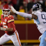 
              Kansas City Chiefs quarterback Patrick Mahomes (15) scrambles as Tennessee Titans defensive end DeMarcus Walker (95) defends during overtime of an NFL football game Sunday, Nov. 6, 2022, in Kansas City, Mo. The Chiefs won 20-17. (AP Photo/Charlie Riedel)
            