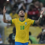 
              FILE - Brazil's Neymar celebrates after scoring his side's opening goal from the penalty spot during a qualifying soccer match for the FIFA World Cup Qatar 2022 against Chile at Maracana stadium in Rio de Janeiro, Brazil, Thursday, March 24, 2022. (AP Photo/Silvia Izquierdo, File)
            