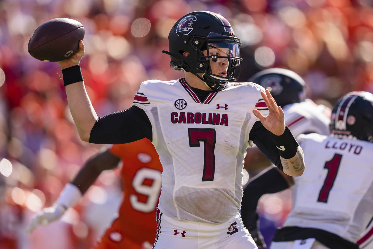 South Carolina quarterback Spencer Rattler (7) passes the ball in the first half of an NCAA college...
