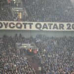 
              A banner reads "boycott Qatar 2022" on the tribune during the German Bundesliga soccer match between FC Schalke 04 and Bayern Munich in Gelsenkirchen, Germany, Saturday, Nov. 12, 2022. (AP Photo/Martin Meissner)
            