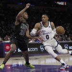 
              Los Angeles Lakers guard Russell Westbrook (0) controls the ball against Brooklyn Nets guard Cam Thomas (24) during the first half of an NBA basketball game in Los Angeles, Sunday, Nov. 13, 2022. (AP Photo/Ashley Landis)
            