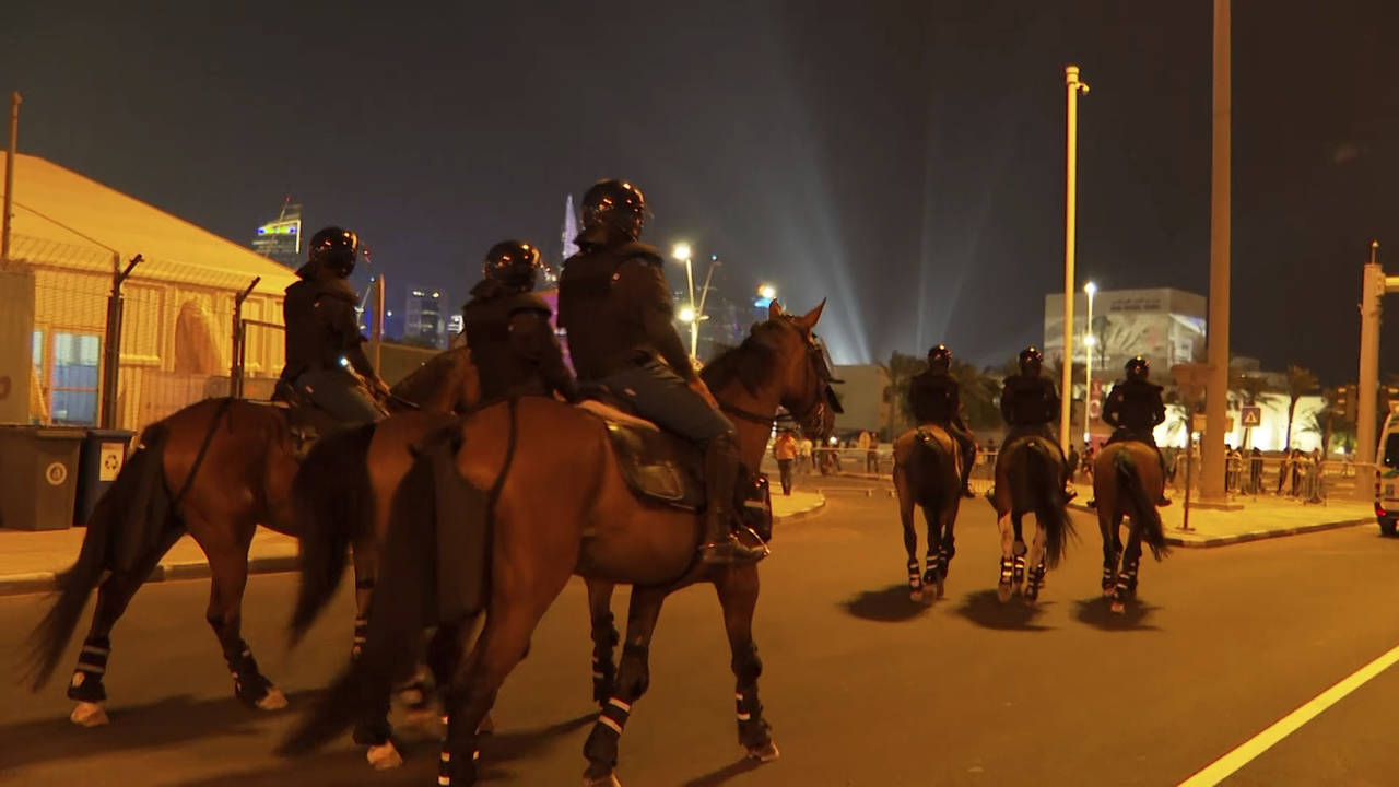 In this image from video, Qatari police patrol on horseback at a FIFA Fan Zone ahead of the World C...