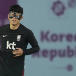 
              South Korea's Son Heung-min warms up during a training session at Al Egla Training Site 5 in Doha, Qatar, Tuesday, Nov. 22, 2022. South Korea will play its first match in Group H in the World Cup against Uruguay on Nov. 24. (AP Photo/Lee Jin-man)
            