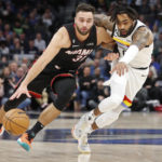 
              Miami Heat guard Max Strus (31) brings the ball upcourt against Minnesota Timberwolves guard D'Angelo Russell, right, in the fourth quarter of an NBA basketball game Monday, Nov. 21, 2022, in Minneapolis. (AP Photo/Bruce Kluckhohn)
            