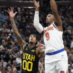
              New York Knicks guard RJ Barrett (9) goes to the basket as Utah Jazz guard Jordan Clarkson (00) defends during the first half of an NBA basketball game Tuesday, Nov. 15, 2022, in Salt Lake City. (AP Photo/Rick Bowmer)
            