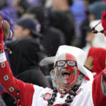 
              An Ohio State fan cheers for his team during the first half of an NCAA college football game against Northwestern, Saturday, Nov. 5, 2022, in Evanston, Ill. (AP Photo/Nam Y. Huh)
            