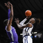 
              Butler center Manny Bates (15) shoots over Kansas State forward David N'Guessan (3) in the first half of an NCAA college basketball game in Indianapolis, Wednesday, Nov. 30, 2022. (AP Photo/Michael Conroy)
            