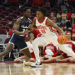 
              Ohio State's Brice Sensabaugh, right, posts up against Charleston Southern's Cheikh Faye during the first half of an NCAA college basketball game Thursday, Nov. 10, 2022, in Columbus, Ohio. (AP Photo/Jay LaPrete)
            