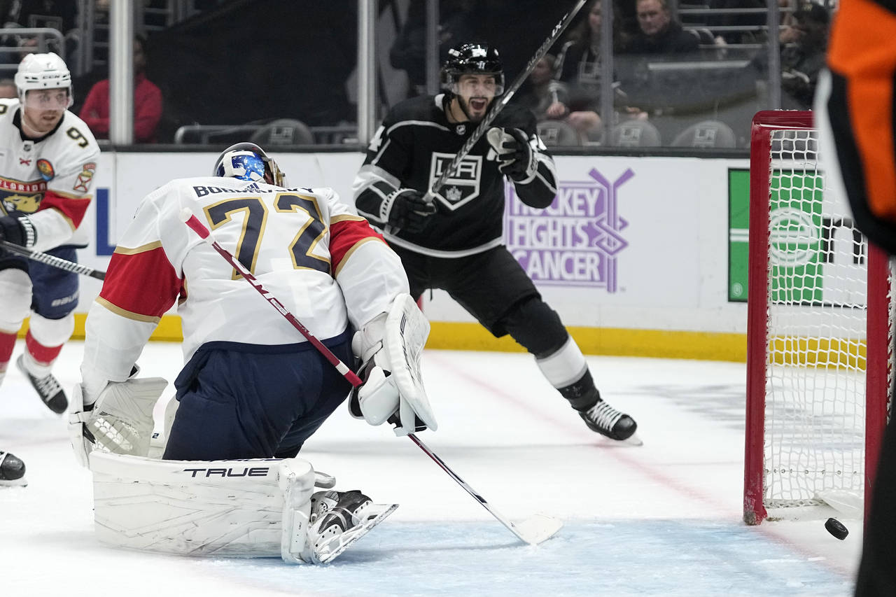 Florida Panthers goaltender Sergei Bobrovsky, center, is scored on by Los Angeles Kings center Trev...
