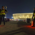 
              Street marshals work prior to the World Cup group G soccer match between Brazil and Serbia, at the Lusail Stadium in Lusail, Qatar, Thursday, Nov. 24, 2022. The 1998 World Cup in France had Ricky Martin. In Qatar, the tune that nests itself in the head is the incessant chanting of street marshals, better knows as Last Mile Marshals. Seated all over Doha on high chairs more commonly used by lifeguards at swimming pools, these migrant workers have become a staple of the Middle East's first World Cup. (AP Photo/Moises Castillo)
            