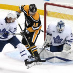 
              Pittsburgh Penguins' Jason Zucker (16) can't get his stick on the puck in front of Toronto Maple Leafs goaltender Matt Murray (30) with Maple Leafs' Rasmus Sandin (38) defending during the first period of an NHL hockey game in Pittsburgh, Tuesday, Nov. 15, 2022. (AP Photo/Gene J. Puskar)
            