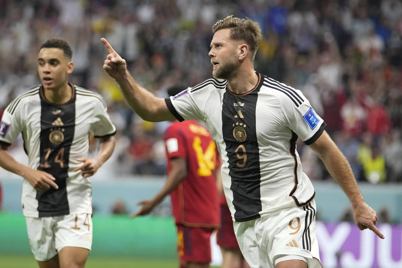Germany's Niclas Fuellkrug celebrates after he scored his side's first goal during the World Cup gr...