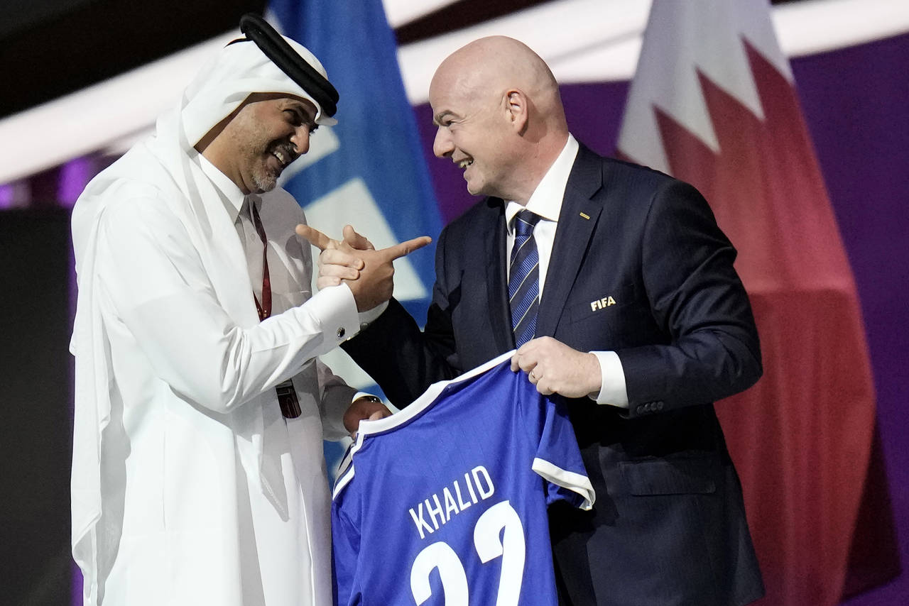 FILE - Prime Minister of the State of Qatar, Khalid Bin Khalifa Bin Abdulaziz Al Thani, left, recei...