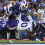 
              Minnesota Vikings fullback C.J. Ham enters the end zone for a touchdown as Buffalo Bills linebacker Terrel Bernard (43) and linebacker Tyrel Dodson (53) try to defend in the second half of an NFL football game, Sunday, Nov. 13, 2022, in Orchard Park, N.Y. (AP Photo/Joshua Bessex)
            