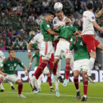 
              Poland's Kamil Glik and Mexico's Henry Martin (20) go for a header during a World Cup group C soccer match at the Stadium 974 in Doha, Qatar, Tuesday, Nov. 22, 2022. (AP Photo/Martin Meissner)
            