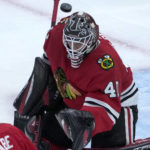 
              The puck flies over the head of Chicago Blackhawks goaltender Arvid Soderblom during the first period of an NHL hockey game against the St. Louis Blues Wednesday, Nov. 16, 2022, in Chicago. (AP Photo/Charles Rex Arbogast)
            