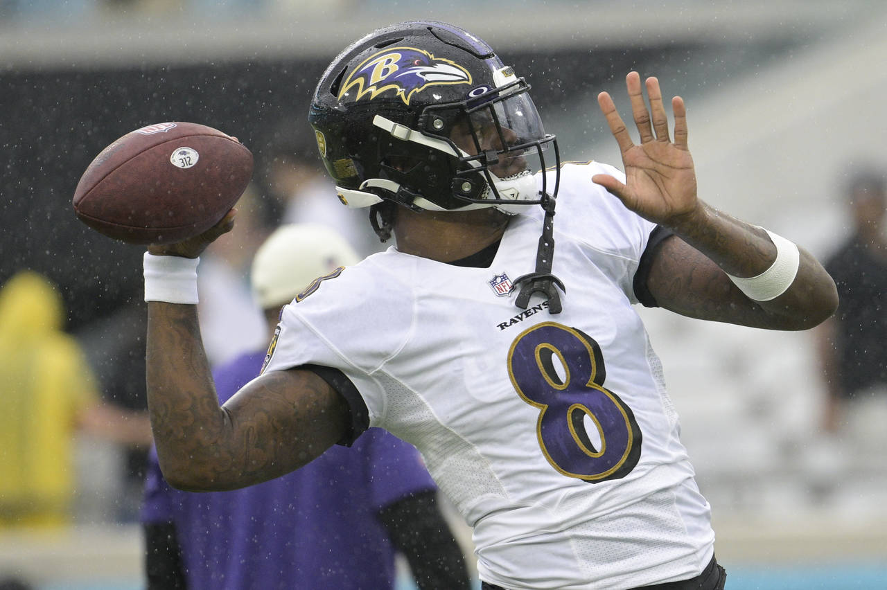 Baltimore Ravens quarterback Lamar Jackson (8) warms up before an NFL football game against the Jac...