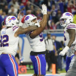 
              Buffalo Bills defensive tackle Ed Oliver (91) reacts after sacking Detroit Lions quarterback Jared Goff for a safety during the second half of an NFL football game, Thursday, Nov. 24, 2022, in Detroit. (AP Photo/Paul Sancya)
            