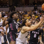 
              Missouri's Tre Gomillion, right, catches a rebound in front of Penn's Eddie Holland III, center, and Noah Carter, left, during the second half of an NCAA college basketball game Friday, Nov. 11, 2022, in Columbia, Mo. Missouri won 92-85. (AP Photo/L.G. Patterson)
            