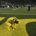 
              Oregon wide receiver Kris Hutson (1) kneels in the end zone after the final play fell short against Washington during the second half of an NCAA college football game Saturday, Nov. 12, 2022, in Eugene, Ore. (AP Photo/Andy Nelson)
            