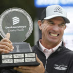 
              Steven Alker lifts the trophy after winning the Dominion Energy Charity Classic golf tournament at The Country Club of Virginia in Richmond, Va., Sunday, Oct. 23, 2022. (Alexa Welch Edlund/Richmond Times-Dispatch via AP)
            