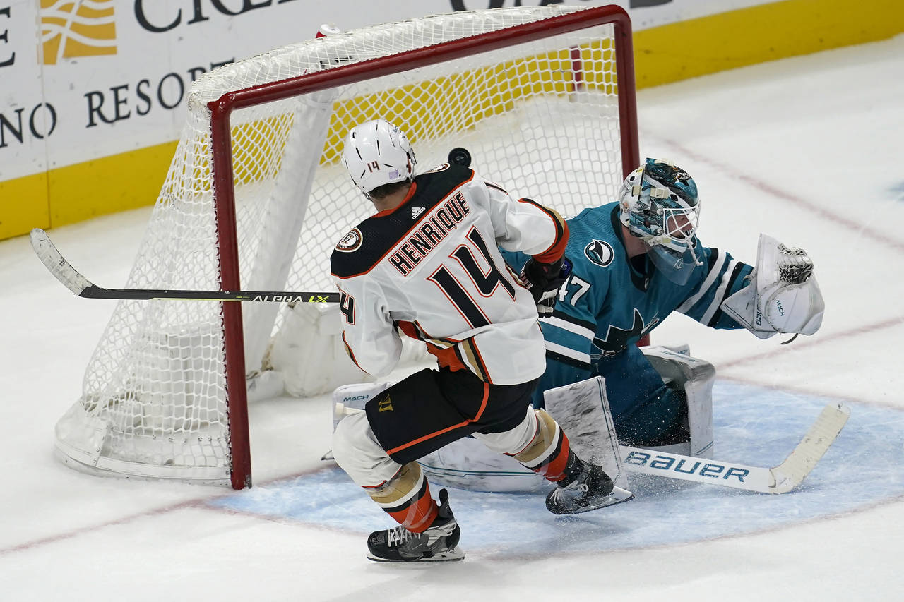 Anaheim Ducks center Adam Henrique (14) scores a goal past San Jose Sharks goaltender James Reimer ...
