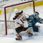 
              Anaheim Ducks center Adam Henrique (14) scores a goal past San Jose Sharks goaltender James Reimer during the shootout in an NHL hockey game in San Jose, Calif., Saturday, Nov. 5, 2022. The Ducks won 5-4. (AP Photo/Jeff Chiu)
            