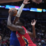 
              New Orleans Pelicans forward Zion Williamson drives to the basket in the first half of an NBA basketball game against the Golden State Warriors in New Orleans, Friday, Nov. 4, 2022. (AP Photo/Gerald Herbert)
            