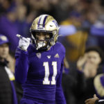 
              Washington wide receiver Jalen McMillan points to the crowd after catching a pass for a first down against Oregon State during the first half of an NCAA college football game Friday, Nov. 4, 2022, in Seattle. (AP Photo/John Froschauer)
            