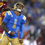 
              UCLA quarterback Dorian Thompson-Robinson celebrates after running the ball for a first down during the first half of an NCAA college football game against Southern California Saturday, Nov. 19, 2022, in Pasadena, Calif. (AP Photo/Mark J. Terrill)
            