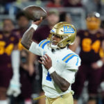 
              UCLA quarterback Dorian Thompson-Robinson (1) throws a touchdown pass against Arizona State during the first half of an NCAA college football game in Tempe, Ariz., Saturday, Nov. 5, 2022. (AP Photo/Ross D. Franklin)
            