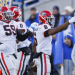 
              Georgia running back Kenny McIntosh (6) celebrates after getting a first down against Kentucky during the first half of an NCAA college football game in Lexington, Ky., Saturday, Nov. 19, 2022. (AP Photo/Michael Clubb)
            