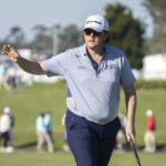 
              Harry Higgs waves at the crowd after finishing on the 18th green during the second round of the RSM Classic golf tournament, Friday, Nov. 18, 2022, in St. Simons Island, Ga. (AP Photo/Stephen B. Morton)
            