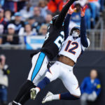 
              Carolina Panthers safety Xavier Woods breaks up a pass intended for Denver Broncos wide receiver Montrell Washington during the second half of an NFL football game between the Carolina Panthers and the Denver Broncos on Sunday, Nov. 27, 2022, in Charlotte, N.C. (AP Photo/Jacob Kupferman)
            