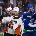 
              Anaheim Ducks' Ryan Strome (16) celebrates his goal against the Vancouver Canucks with Troy Terry (19) during the second period of an NHL hockey game Thursday, Nov. 3, 2022, in Vancouver, British Columbia. (Ben Nelms/The Canadian Press via AP)
            