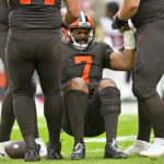 
              Cleveland Browns quarterback Jacoby Brissett (7) is helped up after being sacked by Tampa Bay Buccaneers safety Keanu Neal (22) during the second half of an NFL football game in Cleveland, Sunday, Nov. 27, 2022. (AP Photo/David Richard)
            