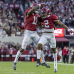 
              Alabama wide receiver Traeshon Holden (11) and running back Jase McClellan (2) celebrate after Holden's touchdown during the first half of an NCAA college football game, Saturday, Nov. 26, 2022, in Tuscaloosa, Ala. (AP Photo/Vasha Hunt)
            