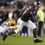 
              Texas A&M running back Devon Achane (6) breaks free from LSU safety Greg Brooks Jr. (3) during the first quarter of an NCAA college football game Saturday, Nov. 26, 2022, in College Station, Texas. (AP Photo/Sam Craft)
            