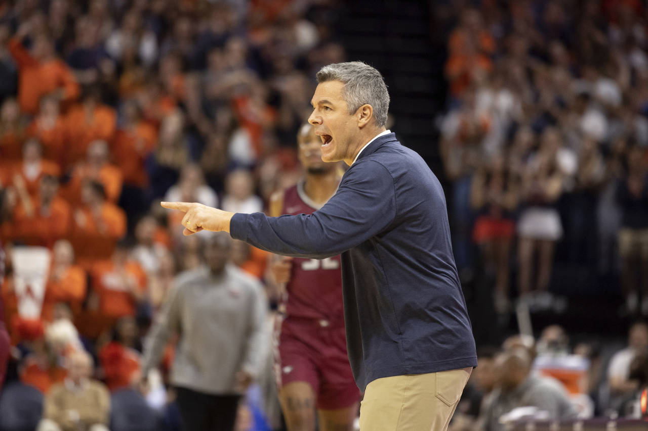 Virginia head coach Tony Bennett yells at his players during the first half of an NCAA college bask...