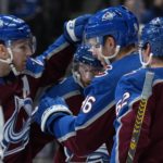 
              Colorado Avalanche right wing Mikko Rantanen (96) celebrates with teammates after his second goal of the night against the Vancouver Canucks, during the first period of an NHL hockey game Wednesday, Nov. 23, 2022, in Denver. (AP Photo/Jack Dempsey)
            