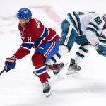 
              Montreal Canadiens' Mike Matheson breaks away from San Jose Sharks' Kevin Labanc during the first period of an NHL hockey game Tuesday, Nov. 29, 2022, in Montreal. (Paul Chiasson/The Canadian Press via AP)
            