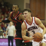 
              San Diego State guard Micah Parrish (3) chases Arizona guard Pelle Larsson (3) during the first half of an NCAA college basketball game, Tuesday, Nov. 22, 2022, in Lahaina, Hawaii. (AP Photo/Marco Garcia)
            
