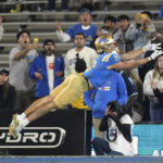 
              UCLA wide receiver Jake Bobo is unable to hold on to a ball thrown to the end zone with no time left in an NCAA college football game against Arizona Saturday, Nov. 12, 2022, in Pasadena, Calif. Arizona won 34-28. (AP Photo/Mark J. Terrill)
            