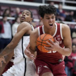 
              Stanford forward Brandon Angel, right, rebounds the ball next to San Diego State forward Keshad Johnson during the first half of an NCAA college basketball game in Stanford, Calif., Tuesday, Nov. 15, 2022. (AP Photo/Godofredo A. Vásquez)
            